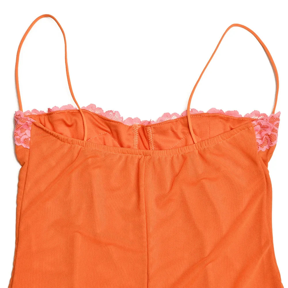 Orange top with pink lace trim on a white background